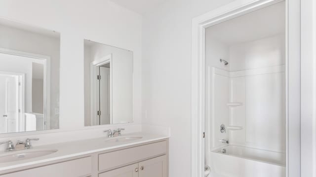 bathroom with bathing tub / shower combination and vanity