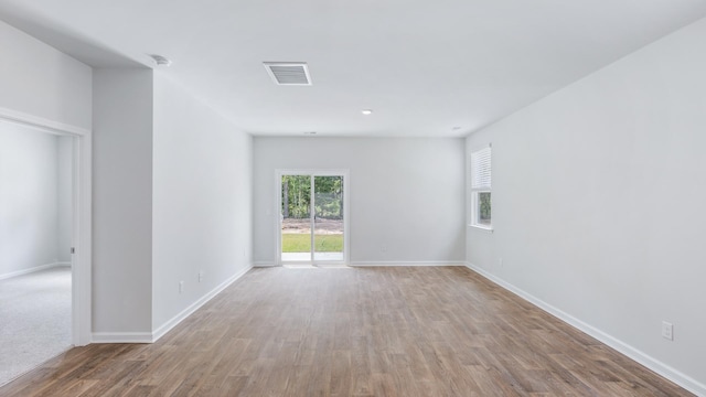 unfurnished room with light hardwood / wood-style floors