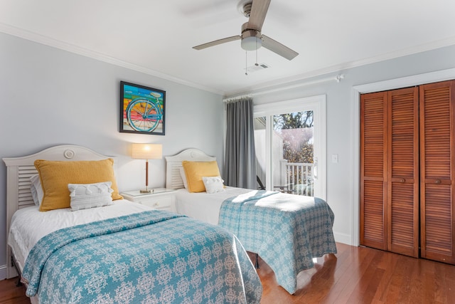 bedroom with ceiling fan, access to outside, hardwood / wood-style flooring, a closet, and ornamental molding