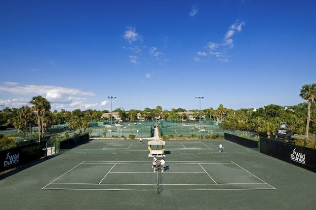 view of sport court featuring a water view