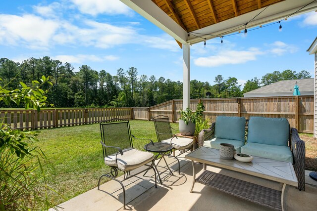 back of house with a patio and a yard