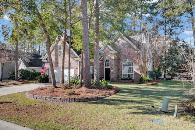 view of front of property with a garage and a front yard