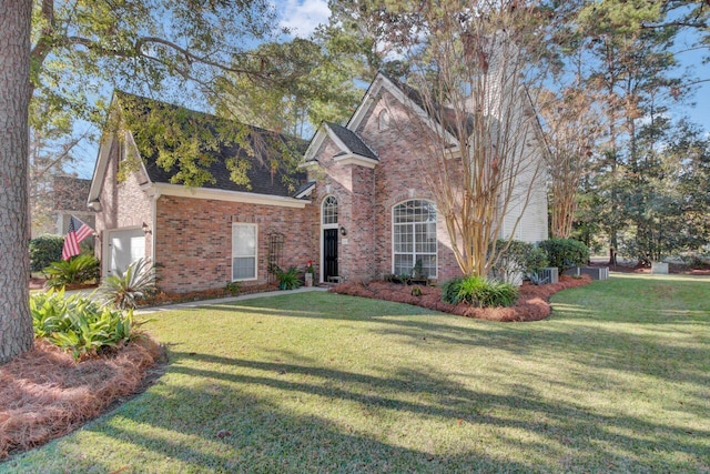 front facade featuring a front lawn and a garage