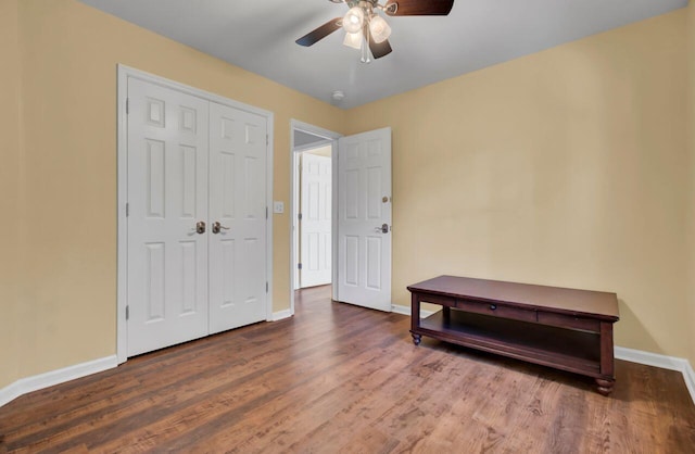 bedroom featuring ceiling fan, a closet, and wood-type flooring