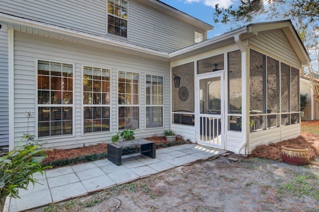 back of house with a sunroom