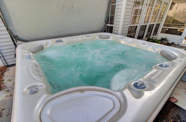 exterior details featuring a hot tub