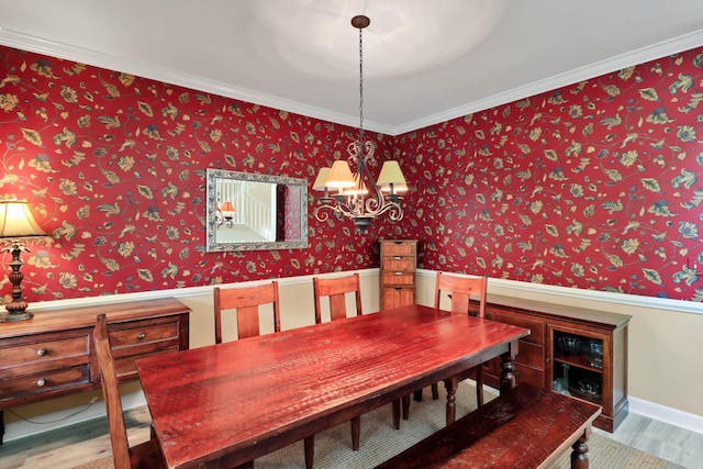 1664 William Hapton Way, Mount Pleasant, SC 29466 - dining room featuring wood finished floors, a chandelier, ornamental molding, and wallpapered walls