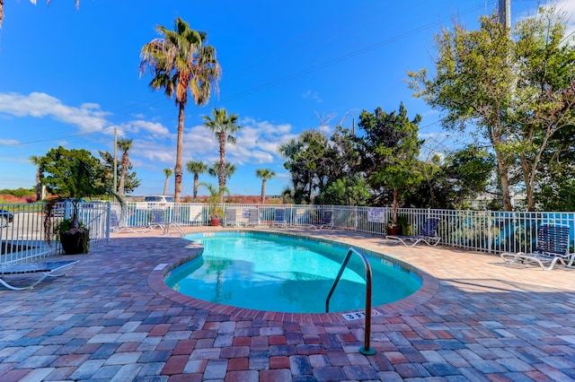 view of swimming pool featuring a patio area