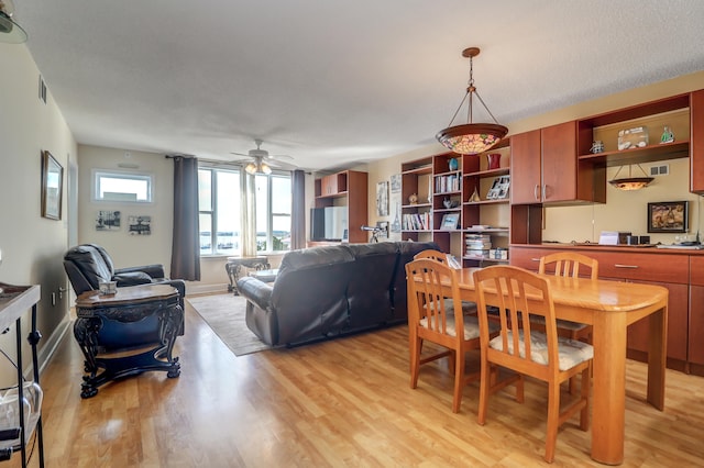 dining area featuring ceiling fan and light hardwood / wood-style flooring