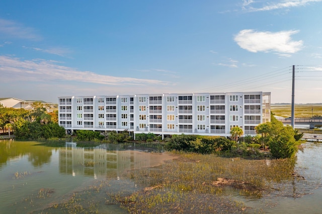 view of building exterior with a water view