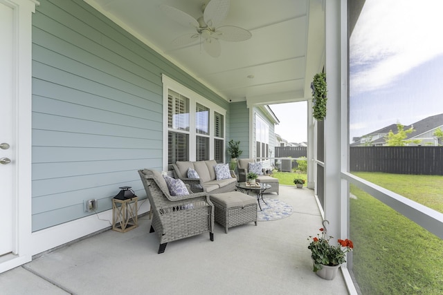 view of patio featuring a ceiling fan and an outdoor living space