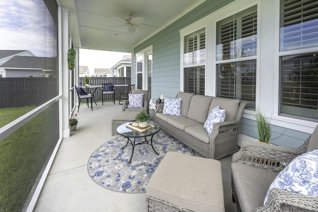 sunroom / solarium featuring a ceiling fan and outdoor lounge area