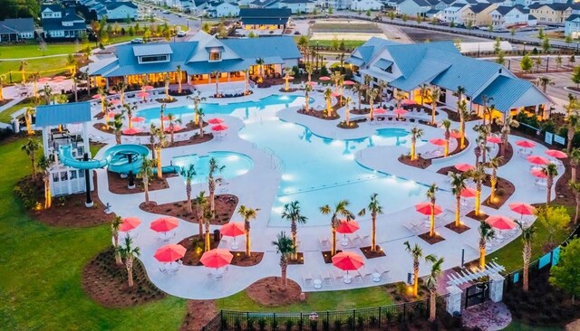 aerial perspective of suburban area featuring a pool area