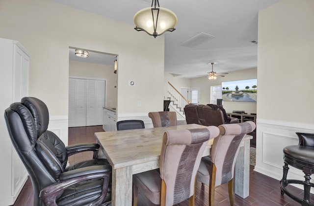 dining area featuring ceiling fan and dark hardwood / wood-style flooring