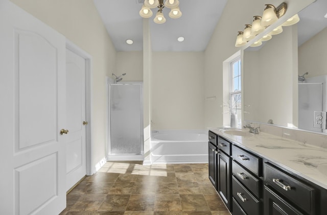 bathroom featuring vanity and shower with separate bathtub