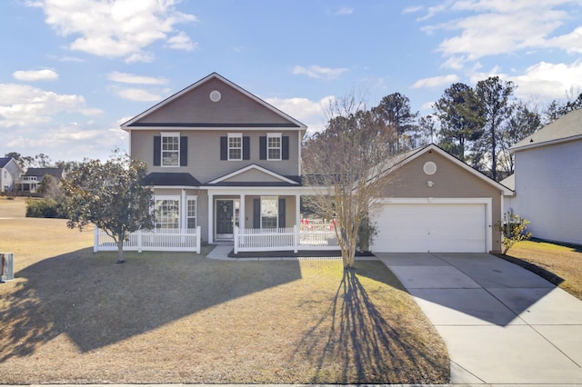 view of front property with covered porch, a front yard, and a garage