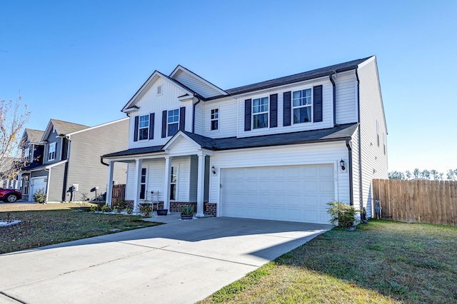 view of front facade with a garage and a front yard