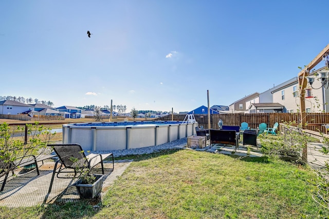 view of yard with a fenced in pool