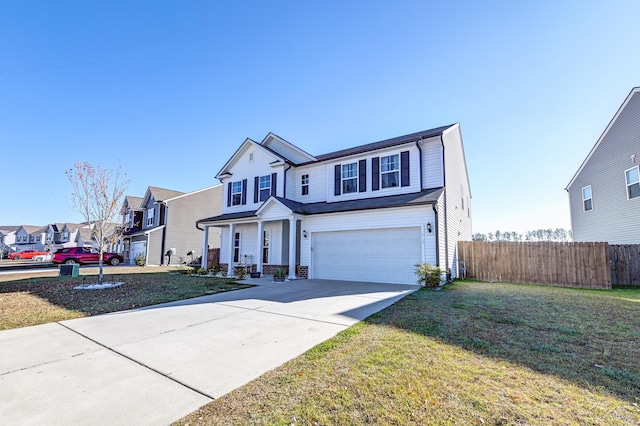 view of front property with a garage and a front yard