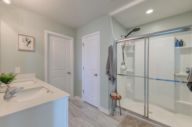 bathroom with vanity and walk in shower