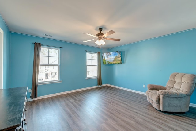 unfurnished room with hardwood / wood-style floors and ceiling fan