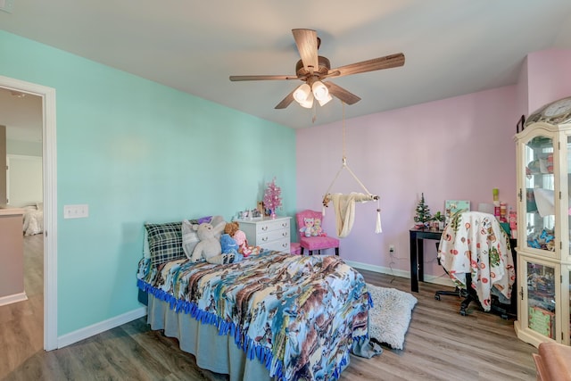 bedroom featuring ceiling fan and wood-type flooring