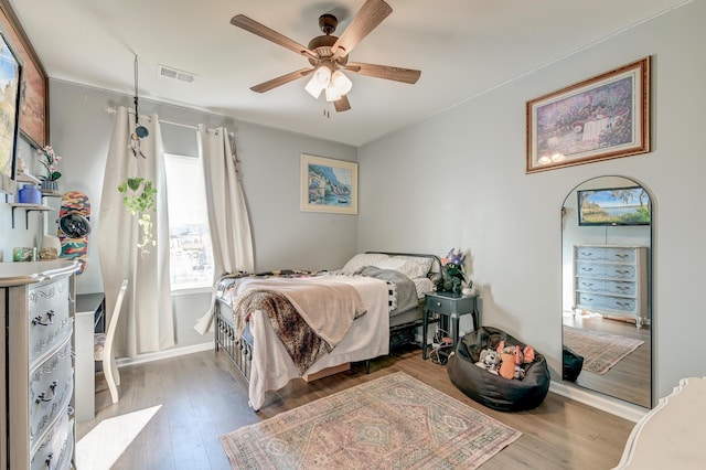 bedroom featuring ceiling fan and light hardwood / wood-style floors