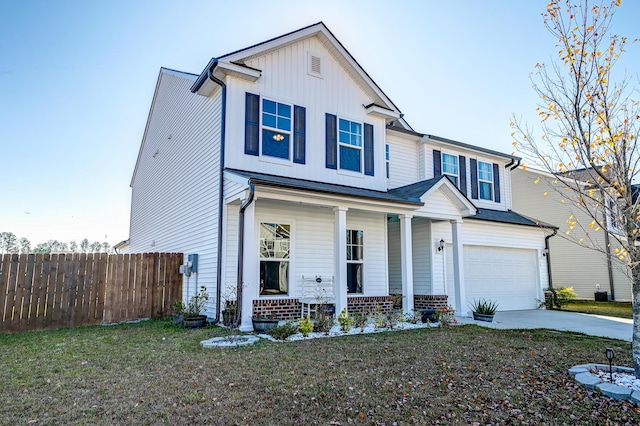 view of front of home featuring a front yard and a garage