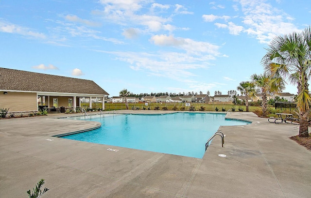 view of swimming pool featuring a patio