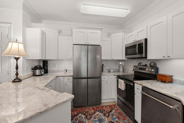 kitchen featuring stainless steel appliances and white cabinets