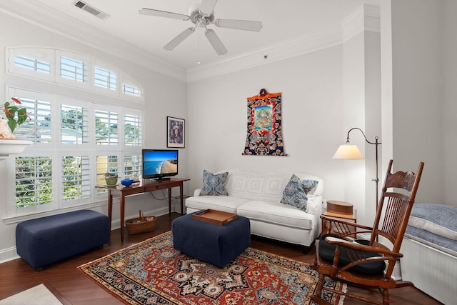 living room with dark wood-type flooring and crown molding