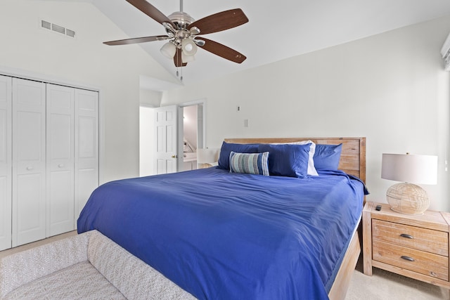 carpeted bedroom featuring a closet, visible vents, ceiling fan, and lofted ceiling