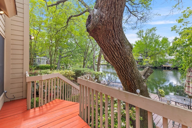wooden deck featuring a water view