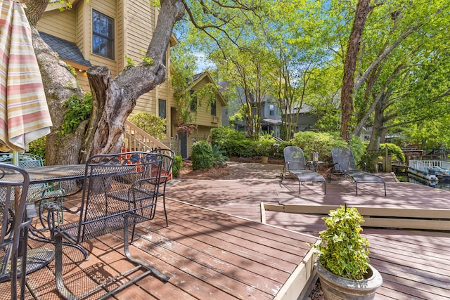 wooden deck featuring outdoor dining space