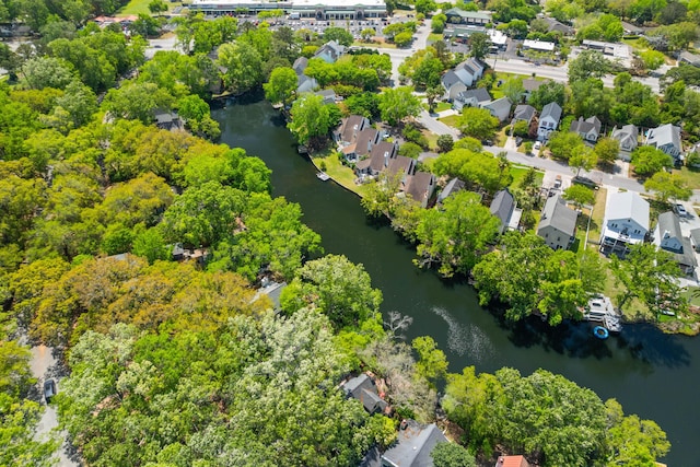 drone / aerial view featuring a water view and a residential view