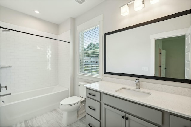 full bathroom with washtub / shower combination, vanity, and toilet