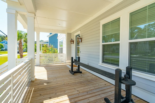 wooden terrace with a porch