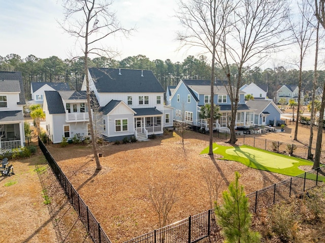 back of house with a residential view and a fenced backyard