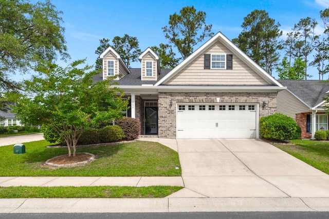207 Brutus Ln, Summerville, SC 29485 - view of front of house featuring a front yard, driveway, a garage, and brick siding