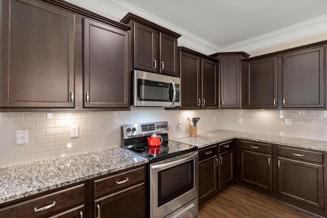 207 Brutus Ln, Summerville, SC 29485 - kitchen with appliances with stainless steel finishes, dark brown cabinetry, light stone countertops, tasteful backsplash, and ornamental molding