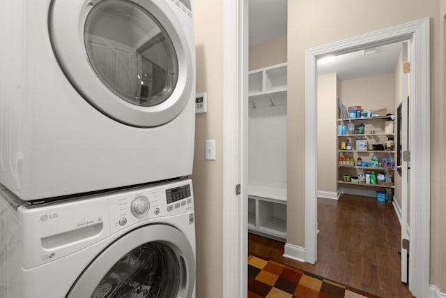 207 Brutus Ln, Summerville, SC 29485 - laundry area with stacked washer and clothes dryer and wood finished floors