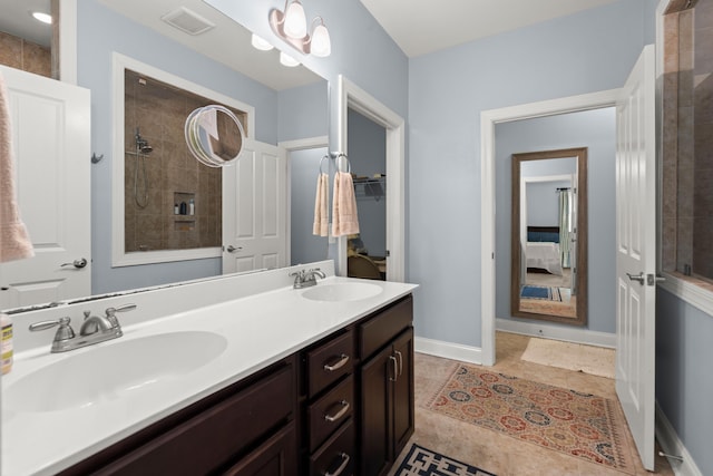 207 Brutus Ln, Summerville, SC 29485 - full bath featuring double vanity, a tile shower, tile patterned flooring, and baseboards