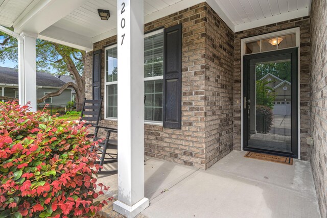 207 Brutus Ln, Summerville, SC 29485 - view of exterior entry featuring brick siding and a porch