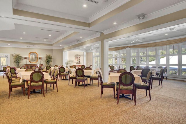 dining room with ornamental molding, recessed lighting, a raised ceiling, and light colored carpet