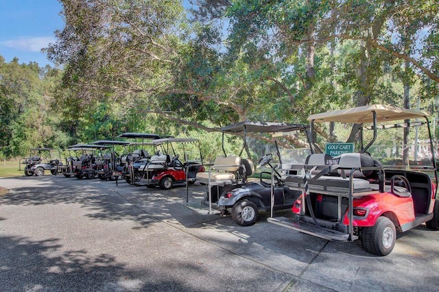 view of parking / parking lot with a carport