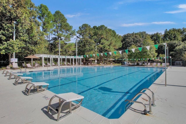 community pool with a pergola