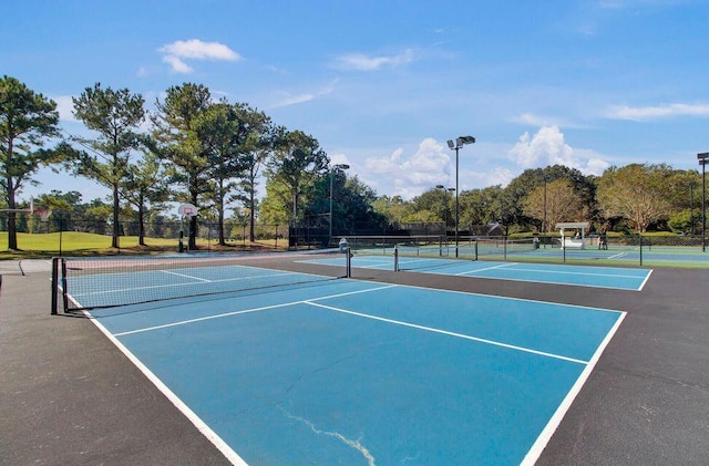 view of sport court with fence