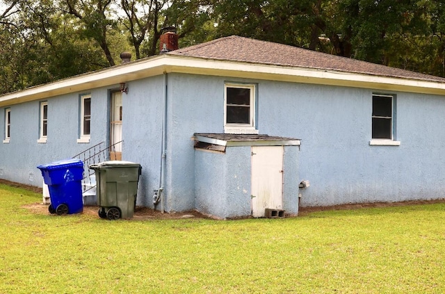 1871 Grimball Rd, Charleston, SC 29412 - view of side of property with a yard and stucco siding