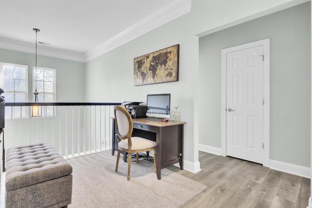 office area with visible vents, baseboards, crown molding, and wood finished floors