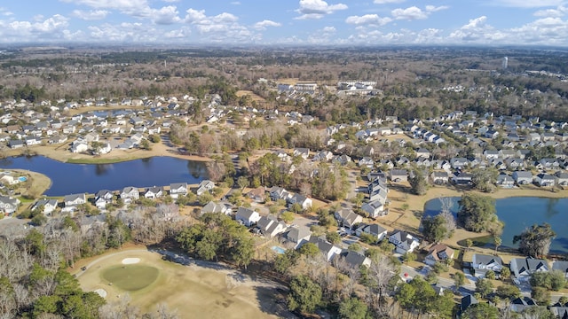 birds eye view of property with a water view and a residential view